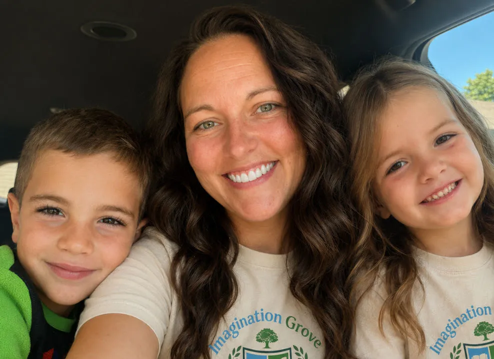 Emily Lee smiling with her two children